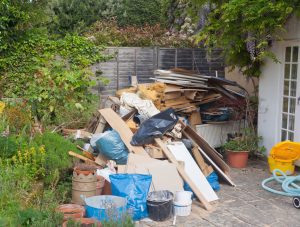 Home renovation and demolition waste piled in backyard