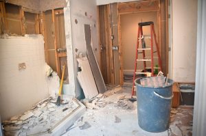 Master Bathroom Remodeling: Demolition Phase. The Master Bathroom is being demolished to the stud walls / subfloor level. Tiles are being taken down and wallpapers are being removed.