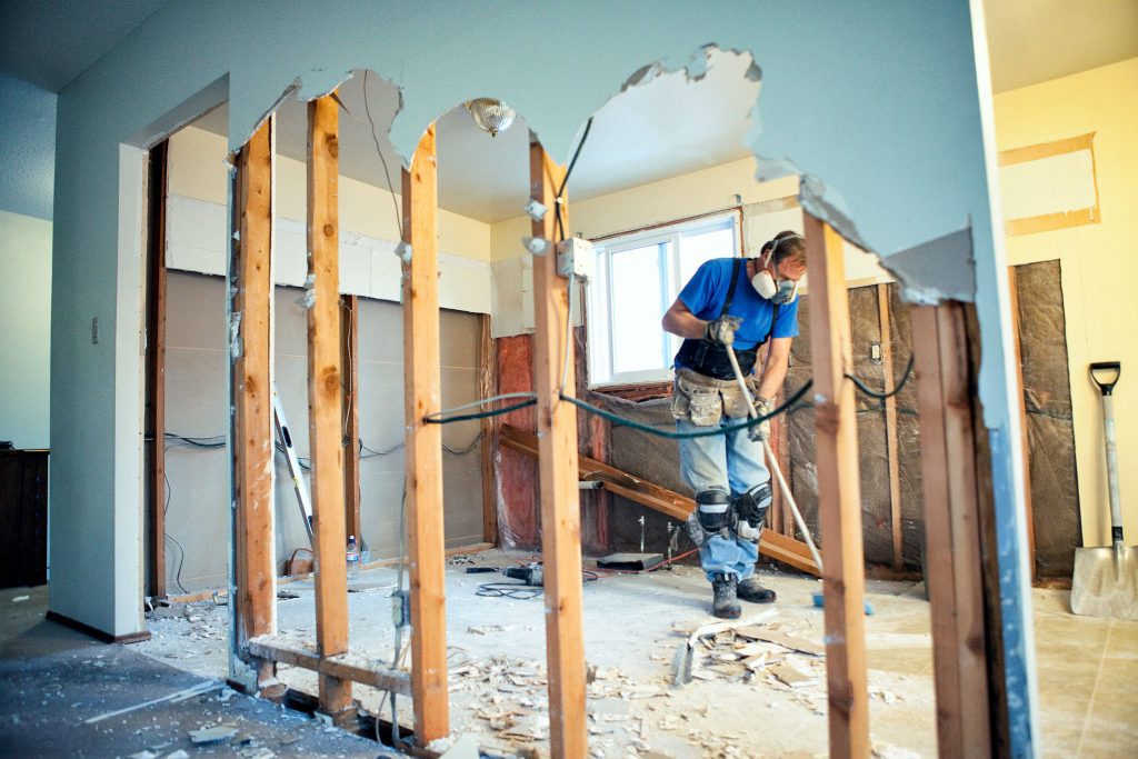 Elite Disposal Services professional cleaning up home kitchen demolition job