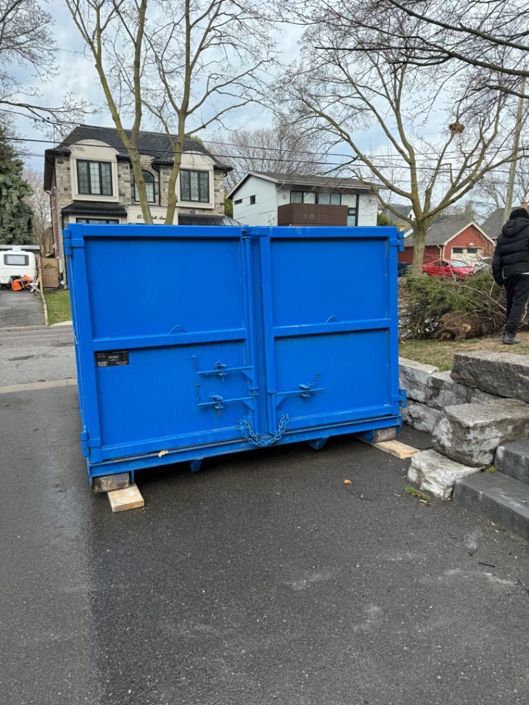 Professional Mississauga dumpster rental service delivering to residential renovation site