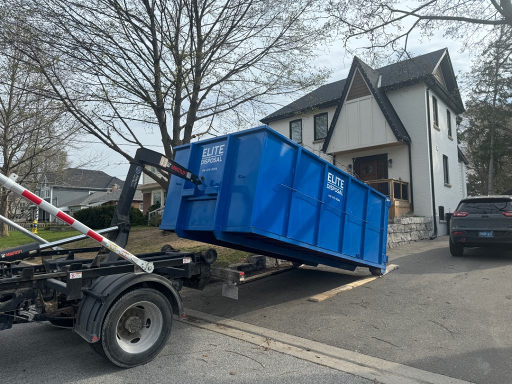 Precision driveway protection dumpster rental delivery using hook lift technology